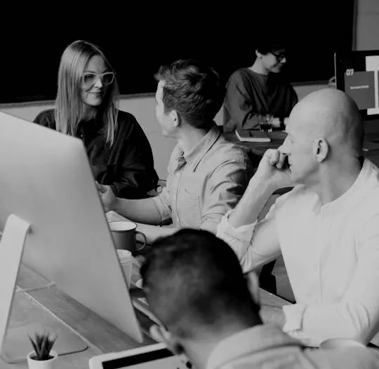 Senior leadership working alongside a business team